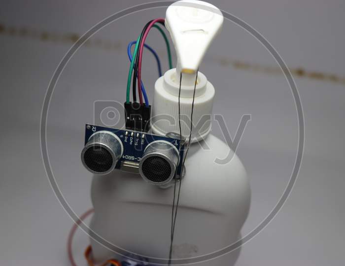 Contactless Hand Sanitizer Dispensing Machine Made Using Sensor