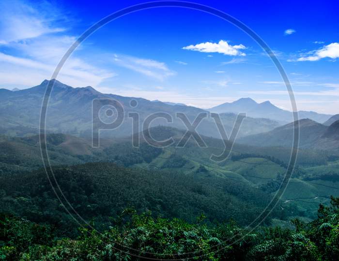 The Scenic beauty of Munnar tea plantation in Southern part of India, Kerala, with Western Ghats mountains region.