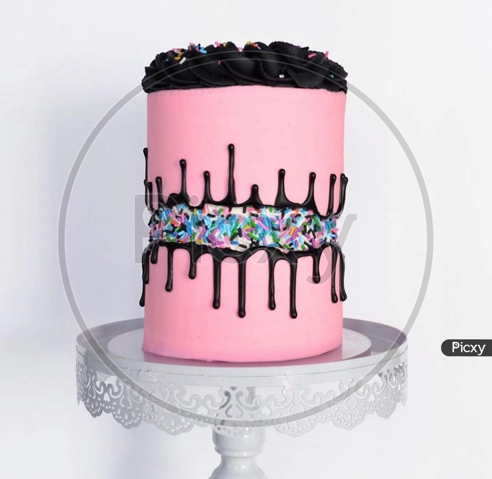 A pink chocolate birthday cake