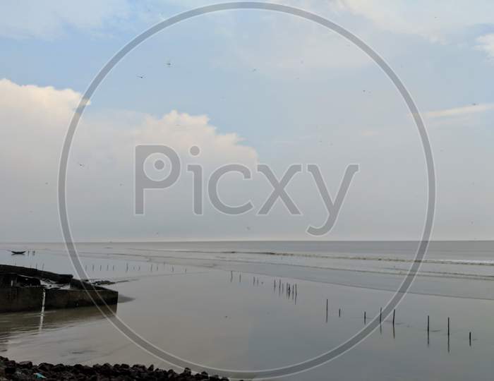 Landscape view of beach, Mandarmani sea beach, a empty sea beach, Bamboos are implanted on beach