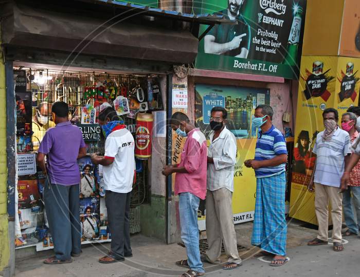 Long queues of buyers as liquor shop reopen in areas outside the containment zone after the announcement of government directives during the lockdown period due to Novel Coronavirus (COVID-19) outbreak.