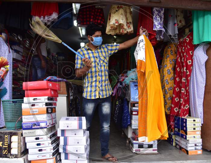 A Shopkeeper Arranges His Garments Shop That Was Opened As Per The Relaxed Covid-19 or Coronavirus Nationwide  Lockdown Guidelines, In Nagaon District Of Assam On  May 5, 2020.