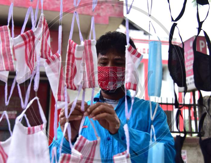 A Man Selling Masks Made From Assamese Traditional Gamosa On His Roadside Shop During Nationwide Lockdown Amidst Coronavirus Or COVID-19 Pandemic  In Nagaon District Of Assam On  May 5, 2020