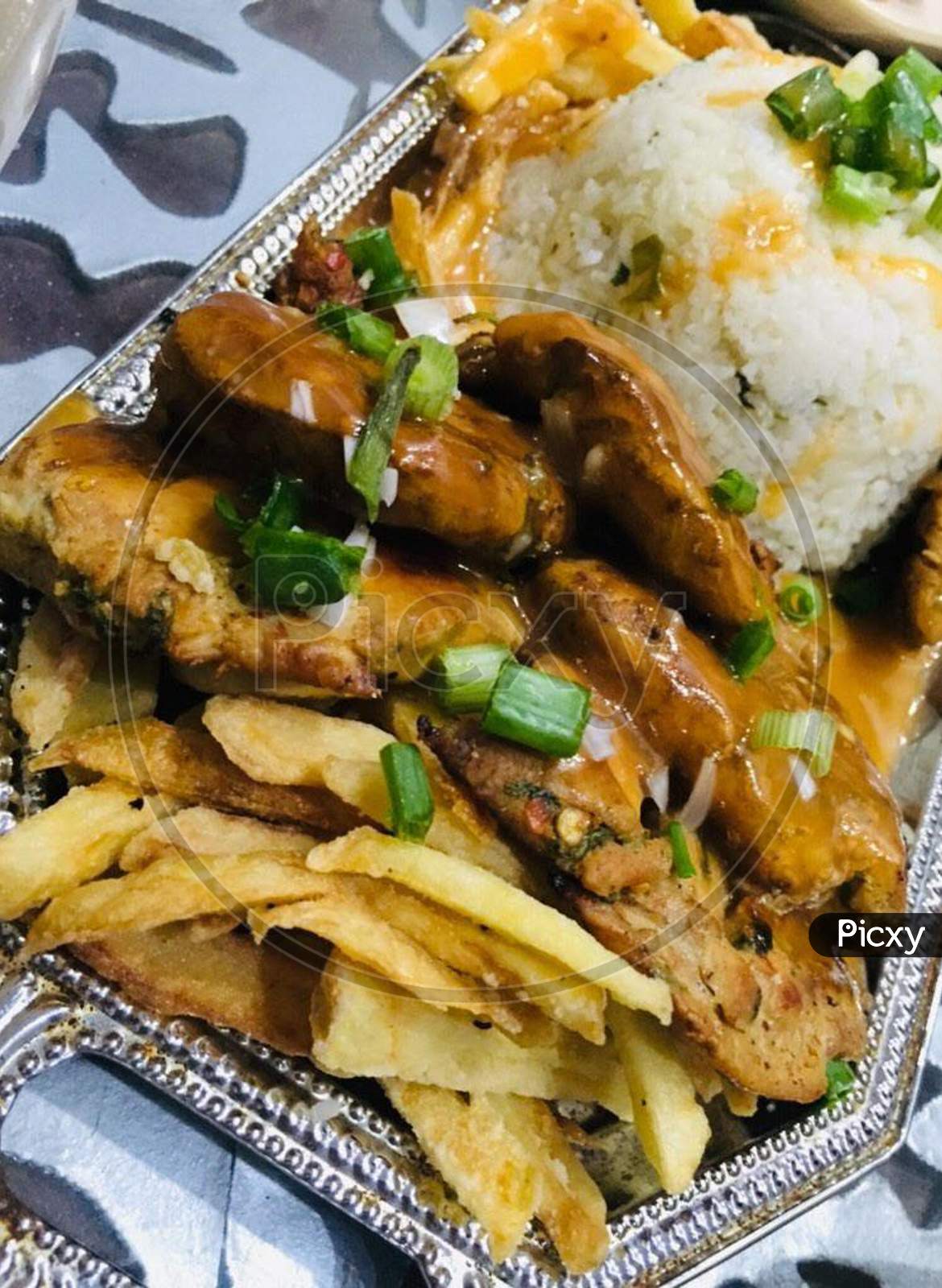 Pakistani food namely Naan and Potato Fries with jar