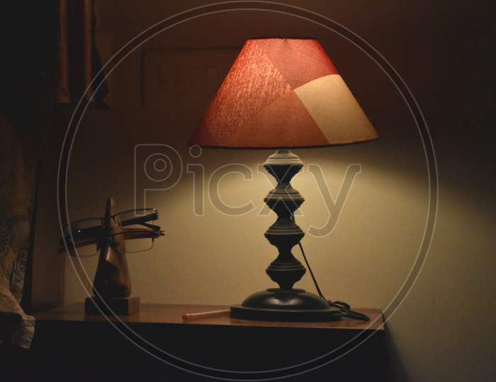 Beautiful lamp giving it's light downward in dark night