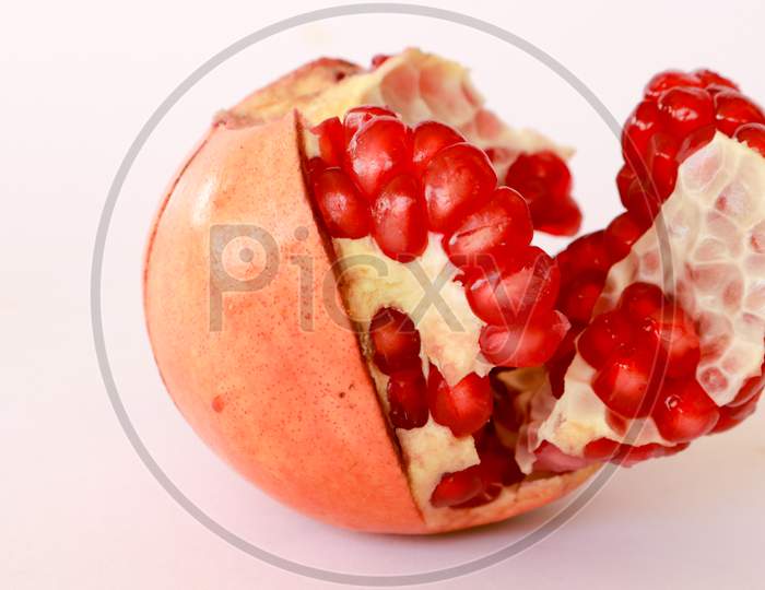 Red juicy fruit pomegranates on a dark background. top view overhead view copy space