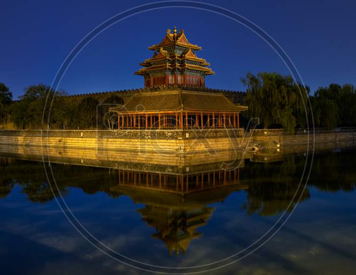 Northwestern Tower Of The Forbidden City Palace Museum In Beijing, China, Reflecting In The Water Moat At Night