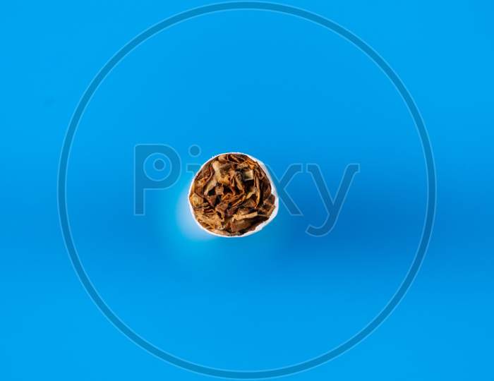 Tobacco Cigarette Close Up With Blue Background