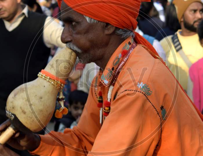 Faridabad, Surajkund, India, February 2019 : 33 Surajkund International Crafts Mela, Artist Playing Been