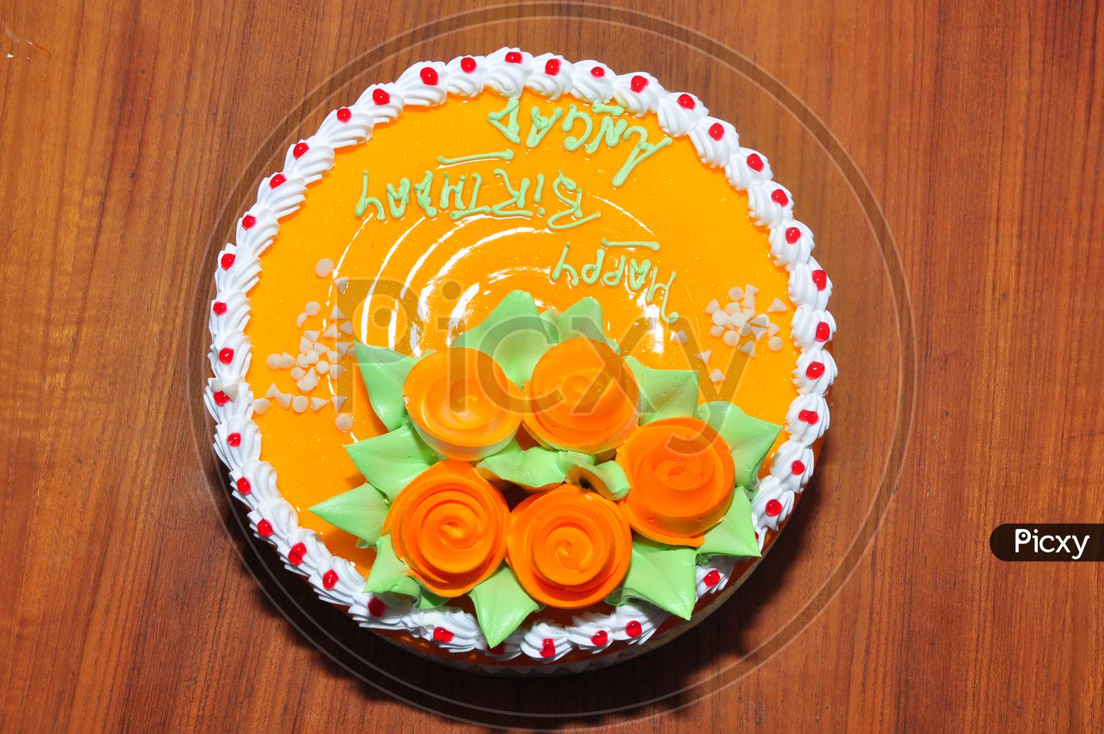 Happy birthday cake in yellow orange