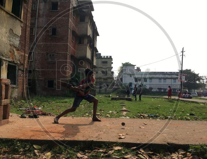 Boys playing cricket at outdoors