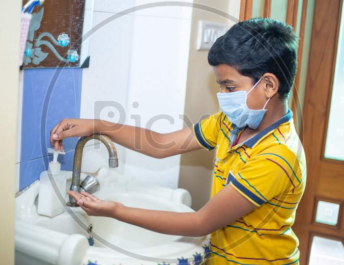 Kid Wearing Mask Washing Hands With Alcohol Gel Or Antibacterial Soap Sanitizer, Hygiene Concept. Prevent The Spread Of Germs And Bacteria And Avoid Infections Corona Virus.