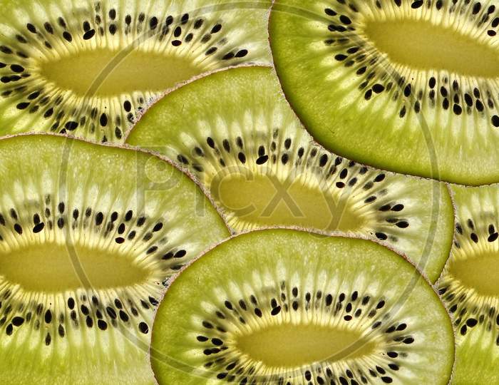 Retouching kiwi slice.healthy and nutritious food.sliced kiwi fruit background.