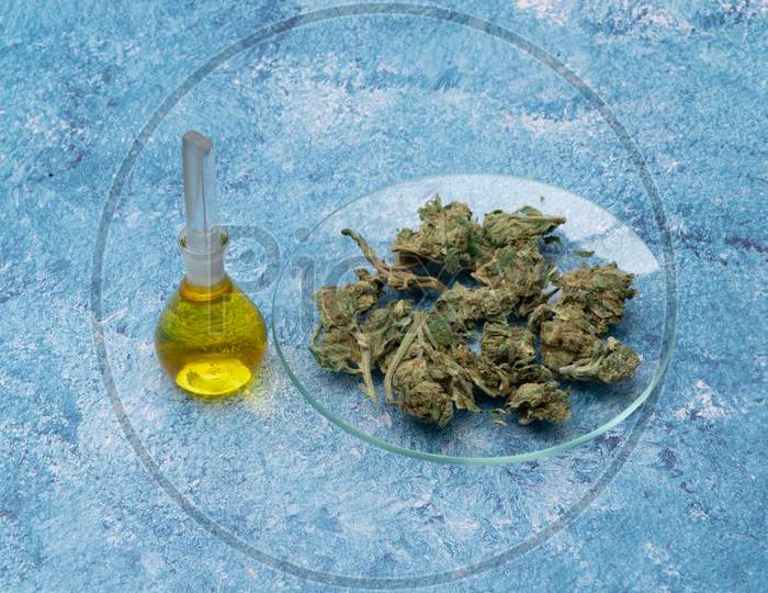 Marijuana Cannabis Medicinal, Weed Joint In A Glass Container. Medical Extract Of Cannabis Marijuana Oil In Jar