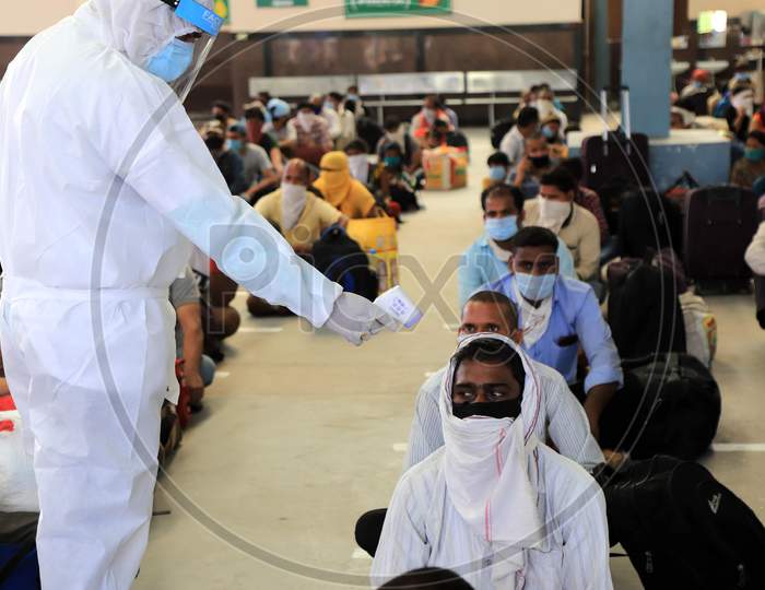 Thermal Screening Conducted For Migrant Workers From Gujarat Who Arrived on A Special Train During Nationwide Lockdown Amidst Coronavirus Or COVID- 19 Pandemic, Prayagraj, May 10, 2020c, Prayagraj, May 10, 2020