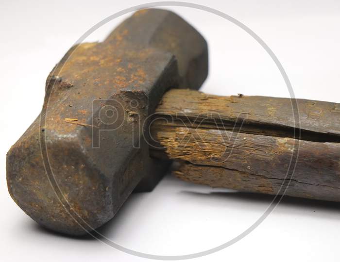 Old And Rusty Hammer With Cracked Wooden Handle