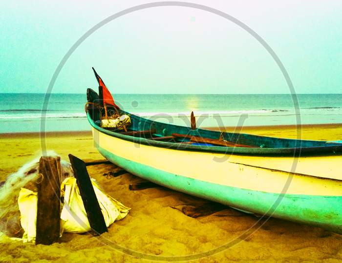 fishing boat on the shores of om beach