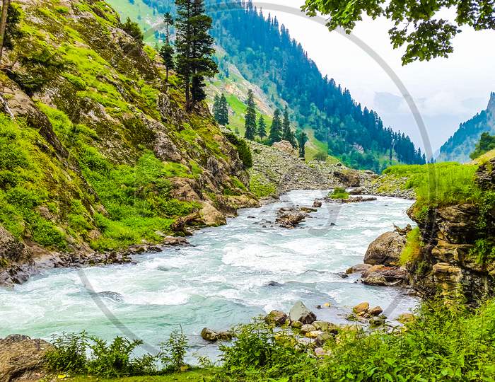 Beautiful river flows through Himalayas in India