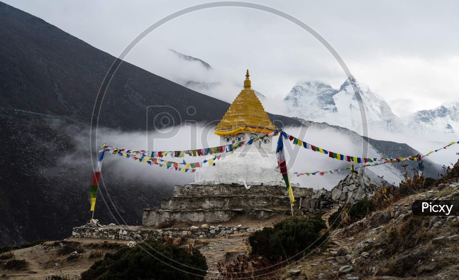 Buddhist stupa near mountains in Himalayas