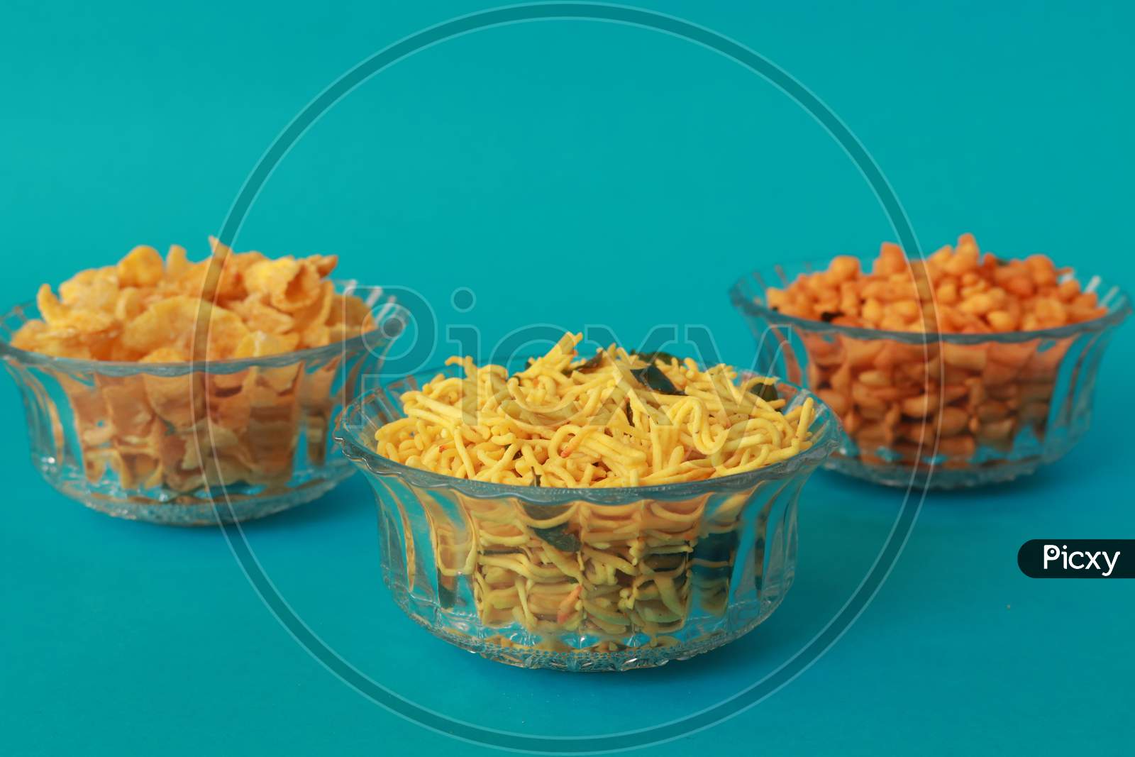 image-of-indian-snacks-with-different-kind-of-dishes-in-bowls-presented