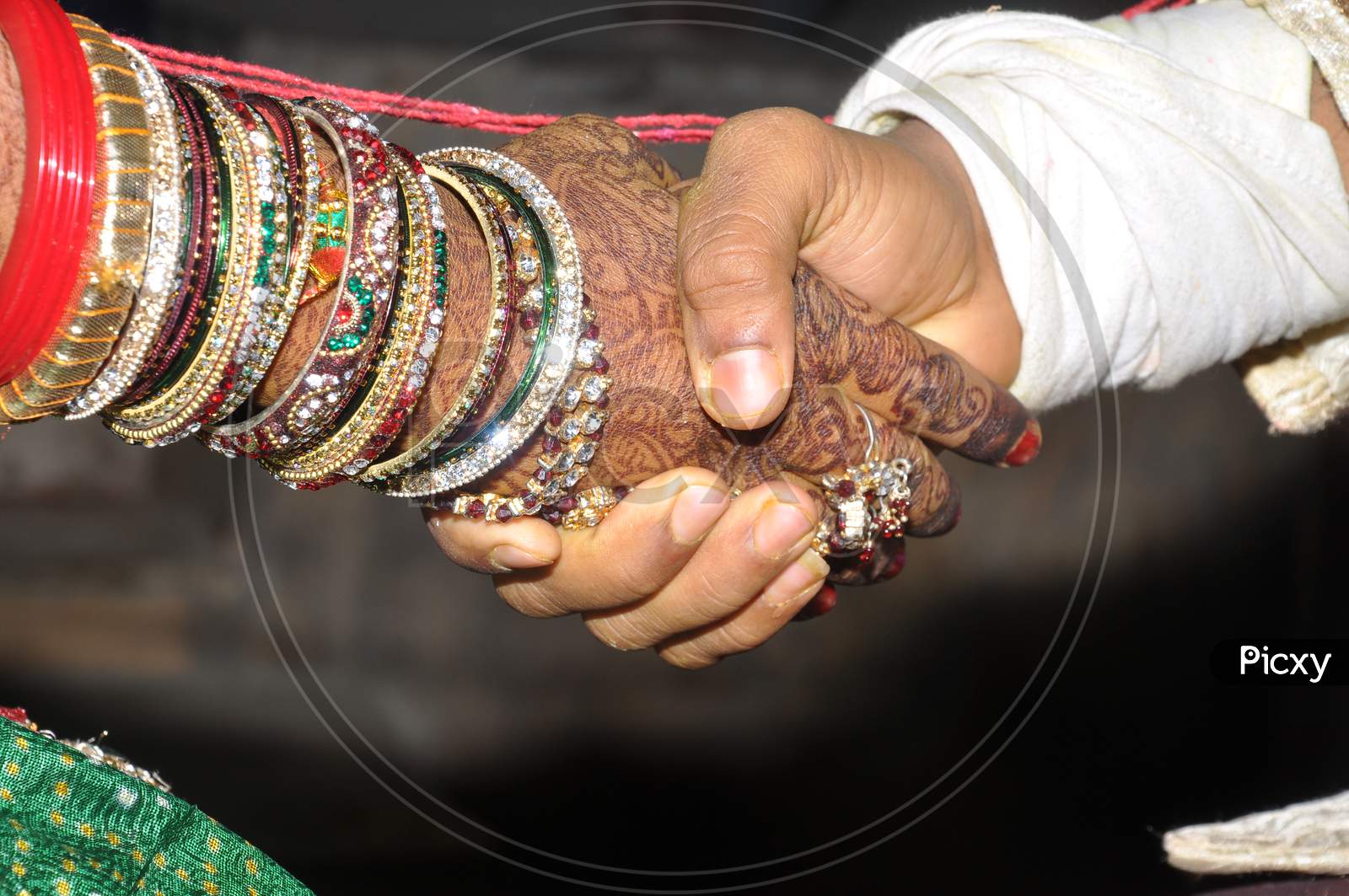 close up of indian couples hands at a wedding