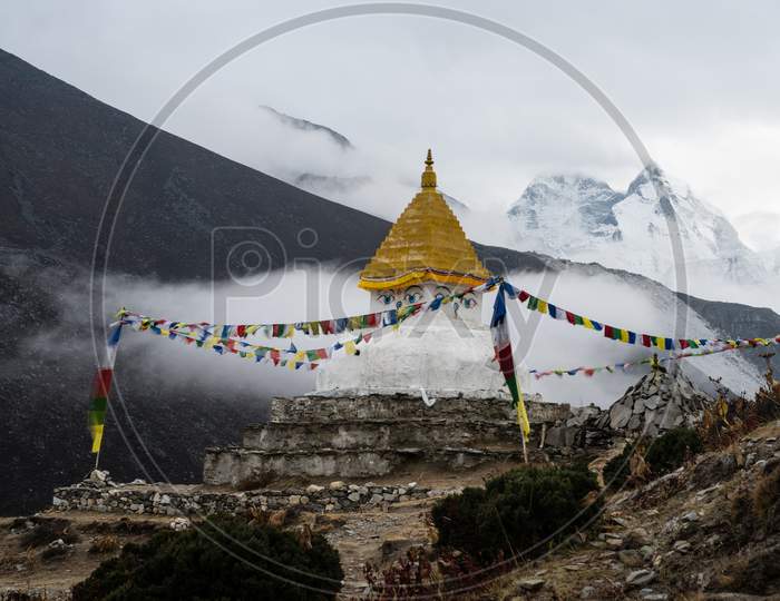 Buddhist stupa near mountains in Himalayas