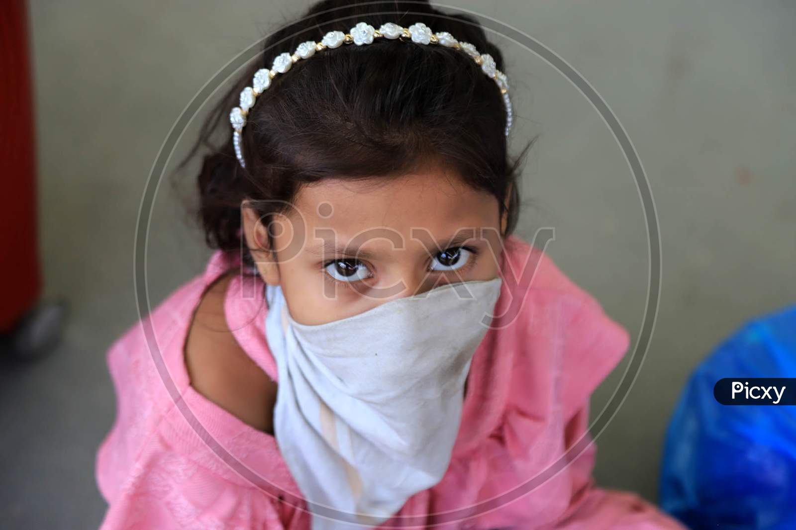 A Girl Child Of a Migrant Laborer Rests After Arriving From Gujarat State On A Special Train At Prayagraj Railway Station During Nationwide Lockdown Amidst Coronavirus Or COVID- 19 Pandemic, Prayagraj, May 10, 2020