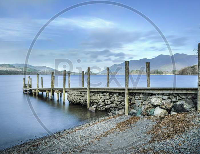 A view of Ashness jetty on the shores of Derwentwater at Barrow Bay