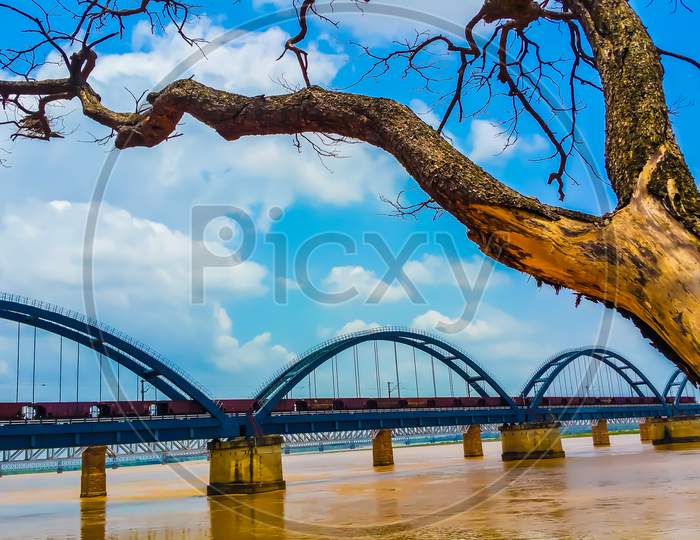 scenic arch bridge across the godavari river.