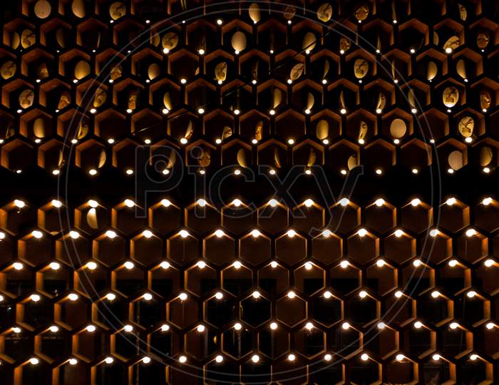 a hexagonal pattern on wall with light decoration