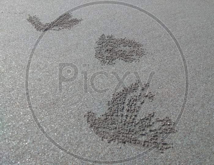 Weird texture at beach in foot print shape