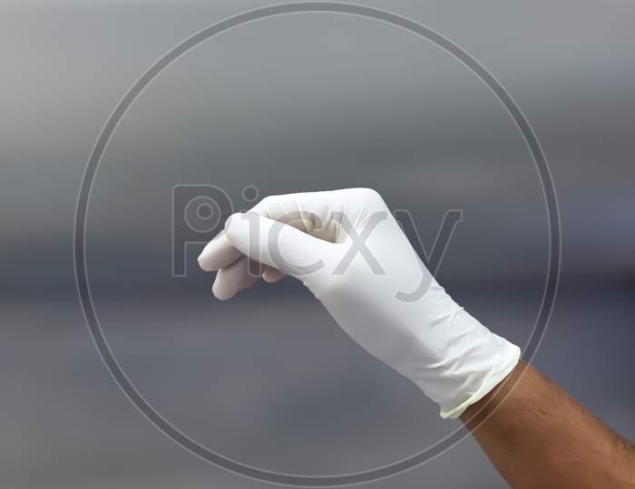 Sterile Glove In Hand Before Surgical Procedure
