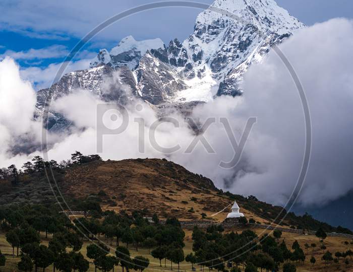 Thamserku mountain, stupa and alpine meadow near Syangboche airport, close to Namche in Everest Base Camp Trek