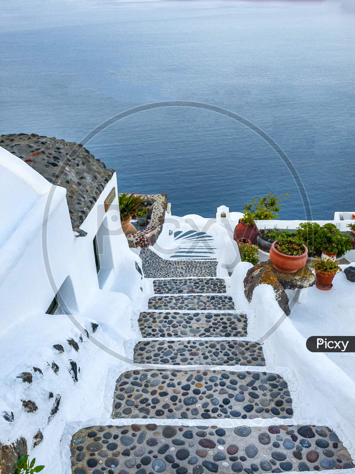 Santorini showing steps leading down to apartments.