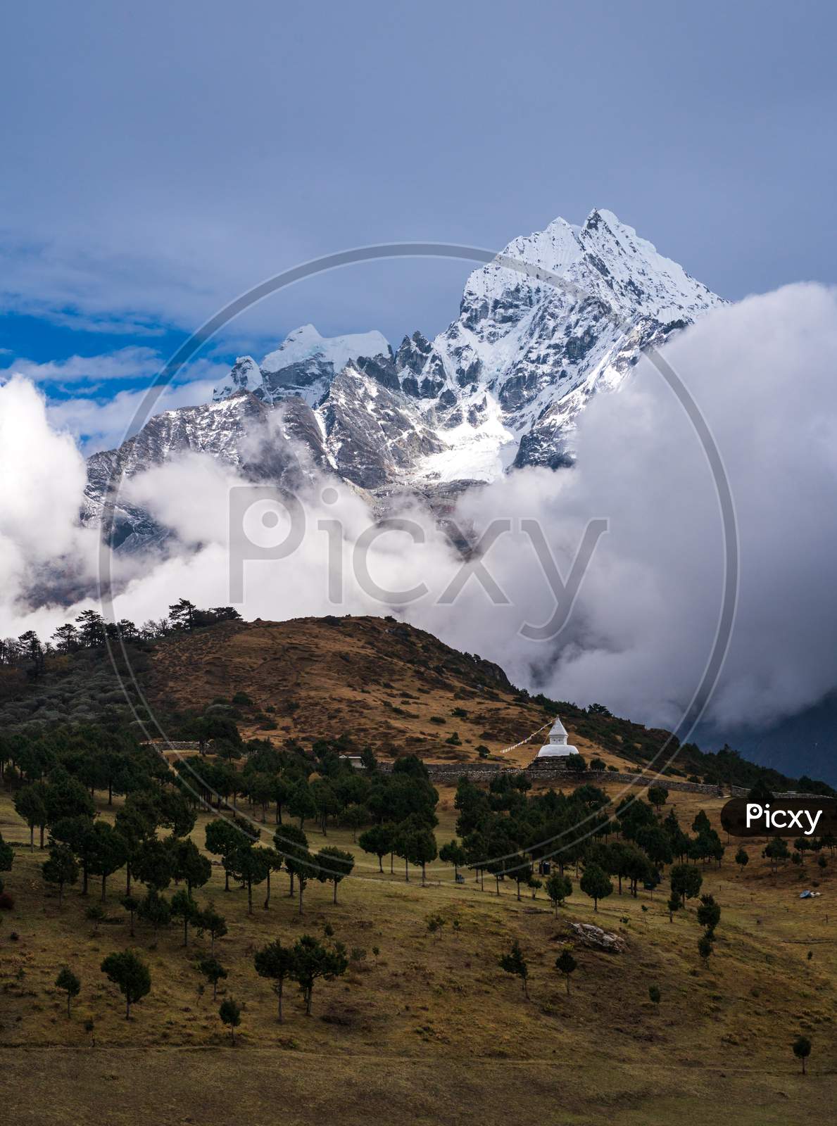 Thamserku mountain, stupa and alpine meadow near Syangboche airport, close to Namche in Everest Base Camp Trek