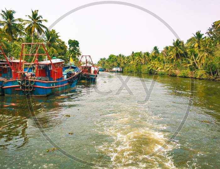 Fishing vessels anchored in the backwaters of kerala