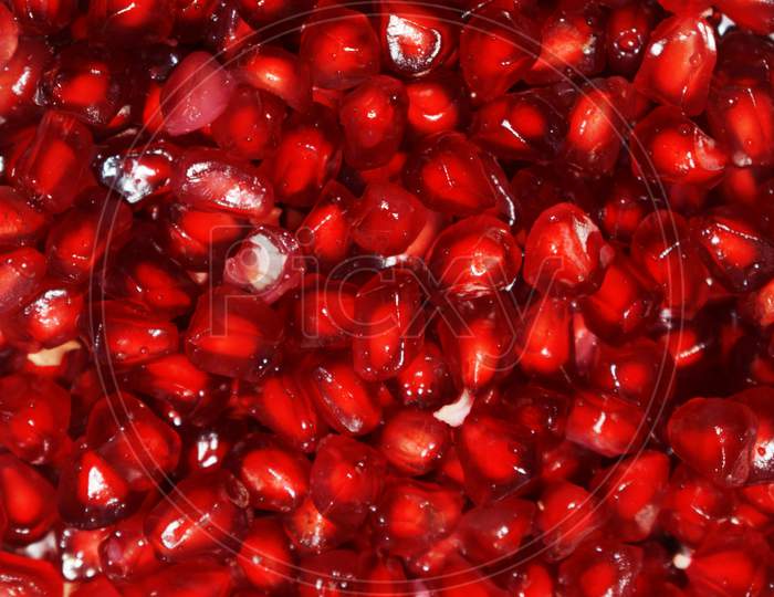 Pomegranate seeds close up background.nutritious food.