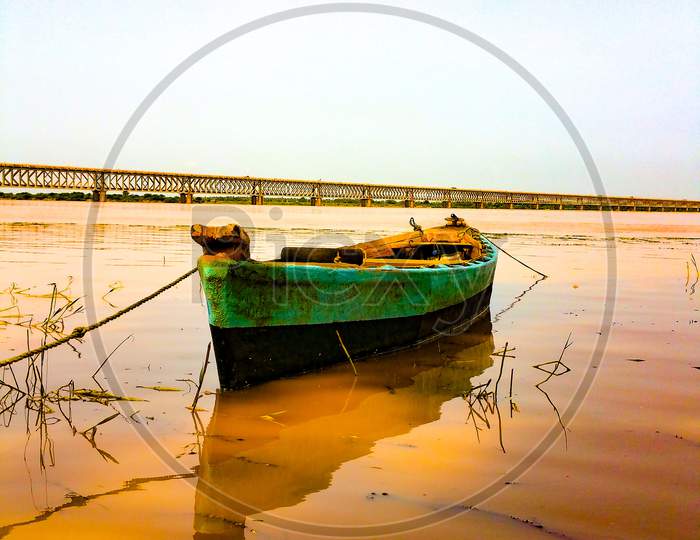 Fishing boat anchored on the banks of Godavari river.