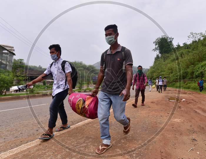 Migrant Workers  Walk Along A Road To Return To Their Villages During Nationwide Lockdown Amidst Coronavirus or COVID-19 Pandemic On The Border Of Assam  And  Meghalaya  In Guwahati,India