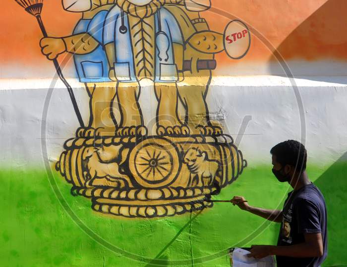 An artist Draws A  Mural On A Wall To Spread  Awareness  During Nationwide Lockdown  Amidst Coronavirus Or COVID-19 Pandemic  In Guwahati, Wednesday, May 6, 2020.onavirus Or COVID-19 Pandemic  In Guwahati, Wednesday, May 6, 2020.