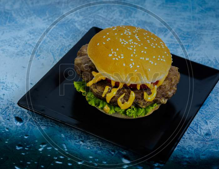 Cheese Burger on black plate