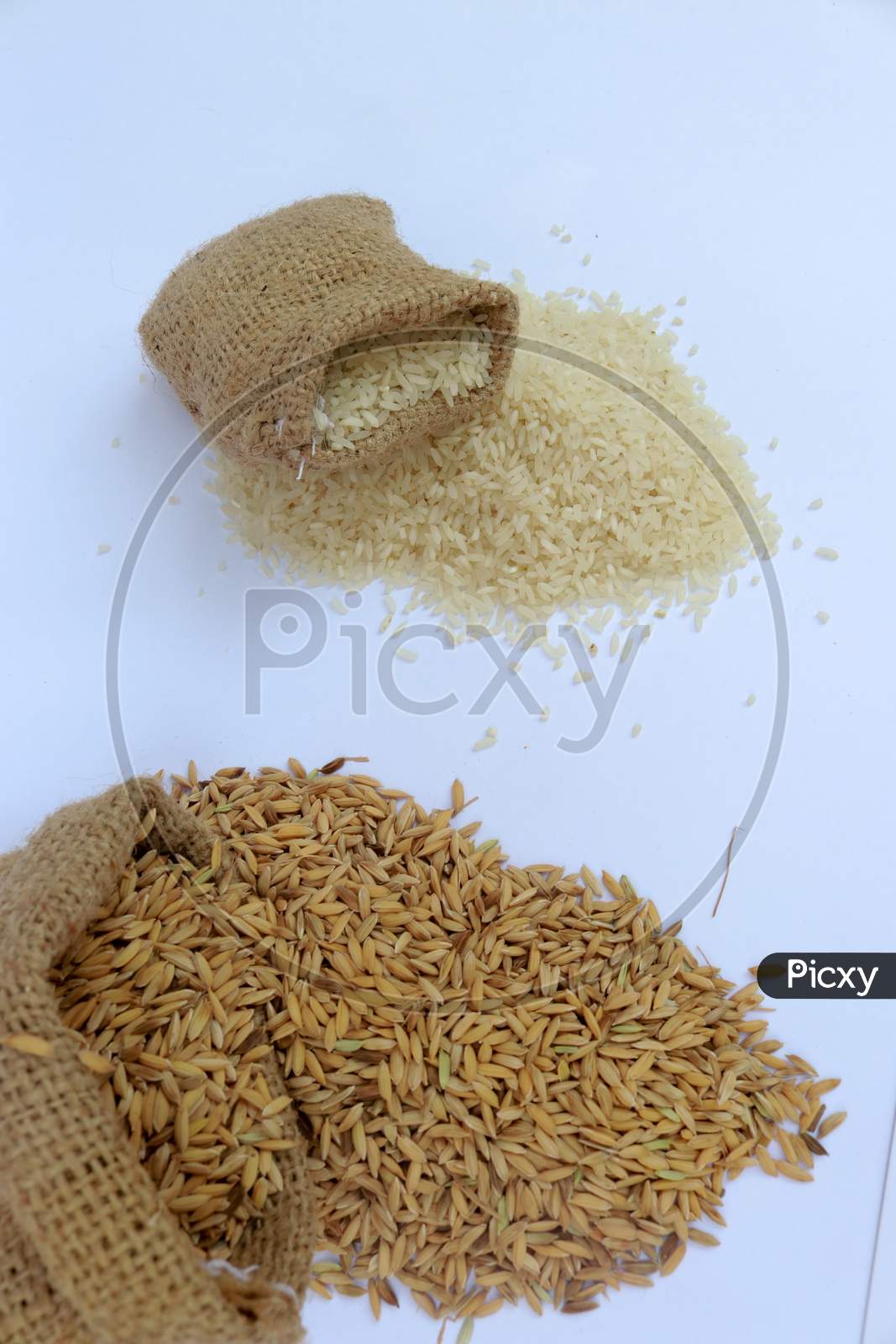 Rice In The Burlap Bag. Healthy Eating And Lifestyle On A White Background