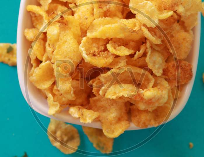 Corn Flakes Snacks Bowl With Blue Background