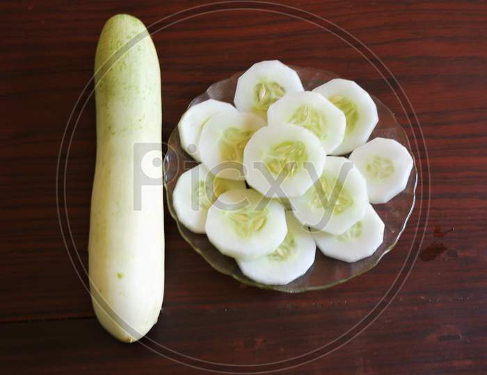 Winter melon and cut pieces in black background