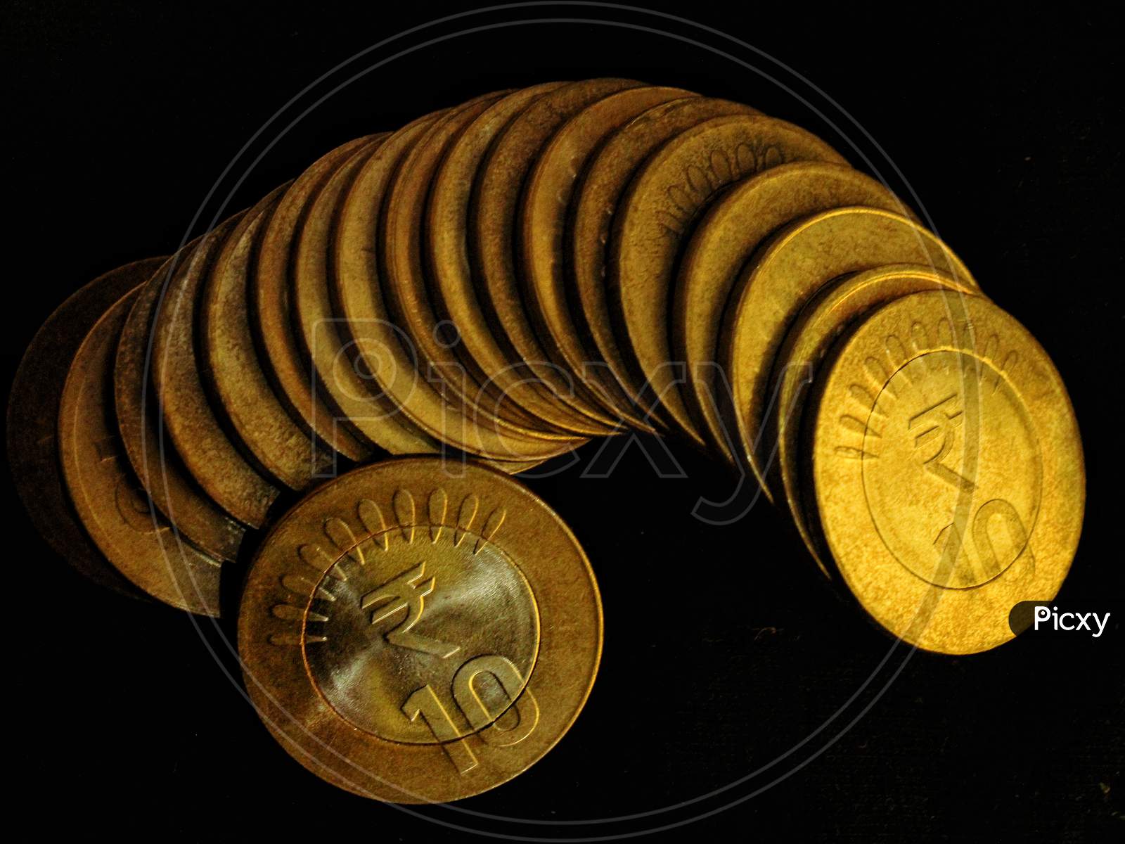 Indian 10 rupee coins with black background