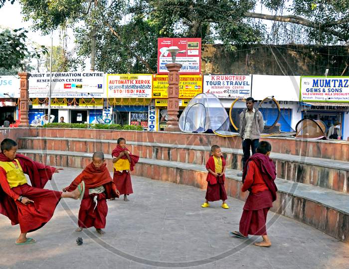 little monks playing at mahabodhi temple compound
