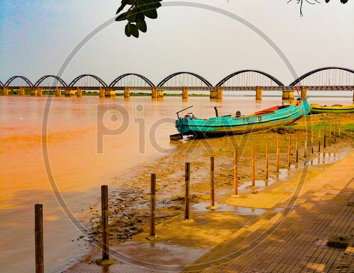wide picture of scenic arch bridge across the Godavari river