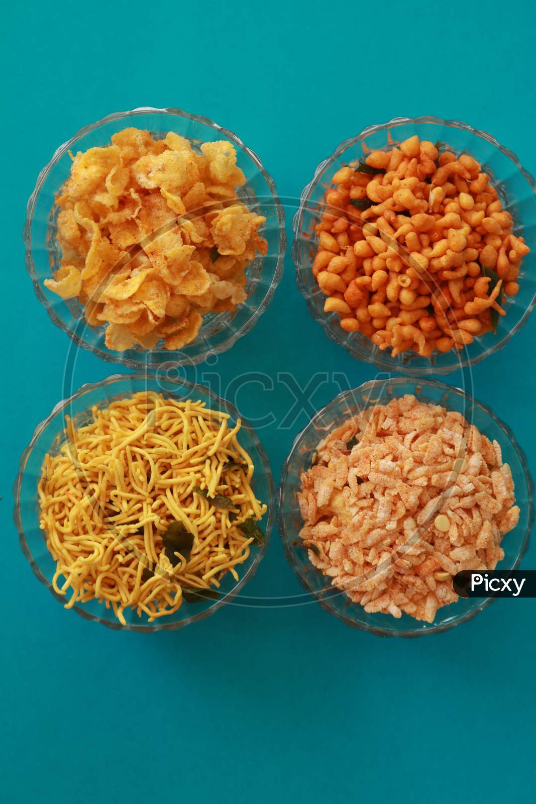 image-of-indian-snacks-with-different-kind-of-dishes-in-bowls-presented