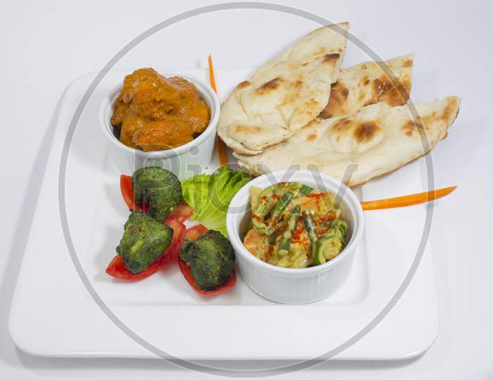 Chicken Harialy Kabab, Chicken Tikka masala curry, Indian Style mix vegetable , plain nan and Green Salad Platter.