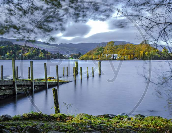 A view of St Herbert's Island the largest of four islands in Derwent Water Keswick Cumbria